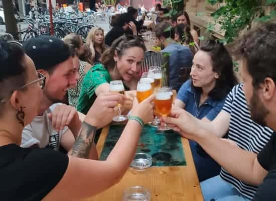 A group of people on a beer tour enjoying a toast together