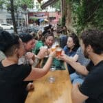 A group of people on a beer tour enjoying a toast together